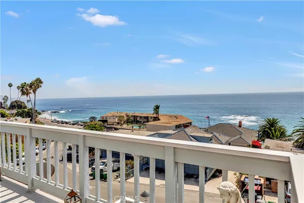 a view of a balcony with an outdoor seating