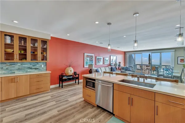 a kitchen with stainless steel appliances granite countertop a sink and cabinets