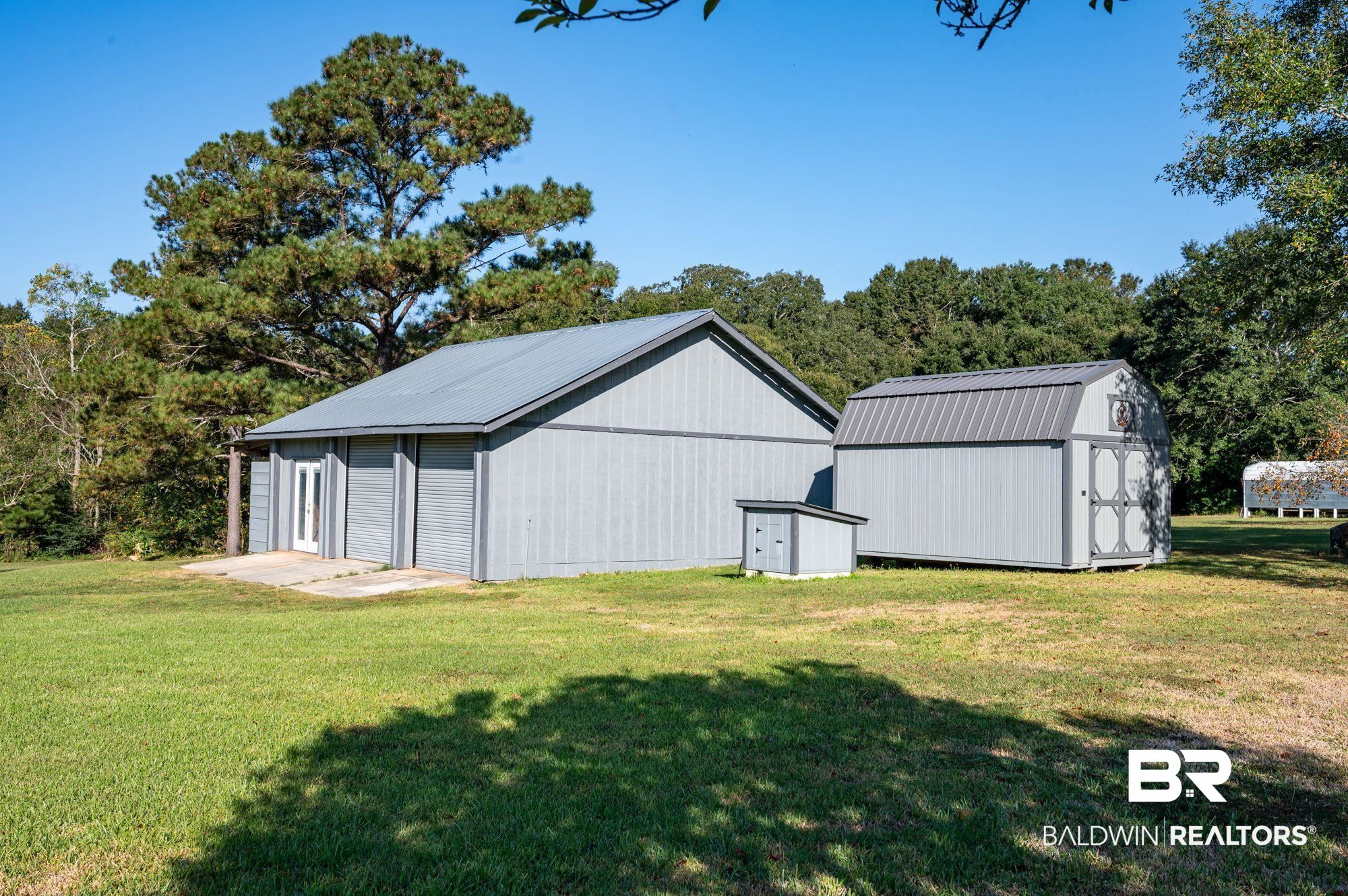 20037 County Road 33 Fairhope, AL 36532 - Photo 38 of 79 View of outdoor structure with a lawn