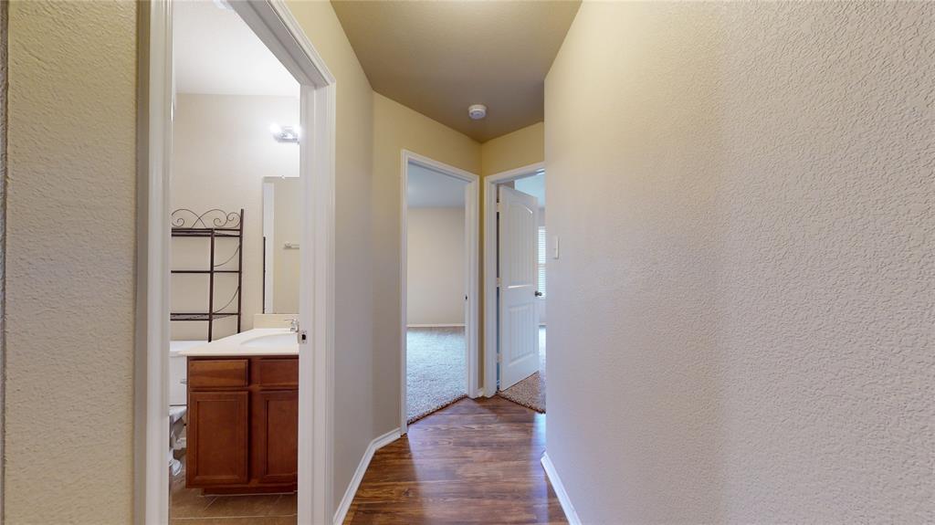 471 Harding Lane Lavon, TX 75166 - Photo 12 of 19 Hall with dark wood finished floors and a textured wall