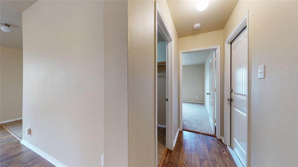 471 Harding Lane Lavon, TX 75166 - Photo 16 of 19 Corridor featuring dark wood-type flooring and baseboards