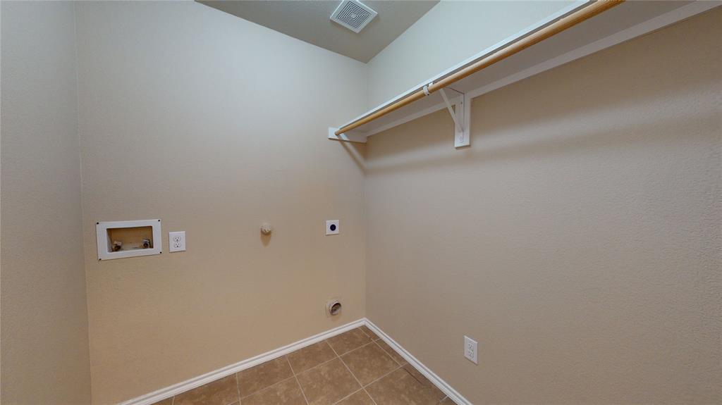 471 Harding Lane Lavon, TX 75166 - Photo 17 of 19 Laundry area with gas dryer hookup, hookup for a washing machine, hookup for an electric dryer, and light tile patterned flooring