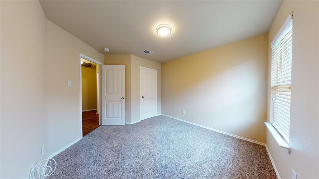 471 Harding Lane Lavon, TX 75166 - Photo 18 of 19 Unfurnished bedroom with baseboards and carpet