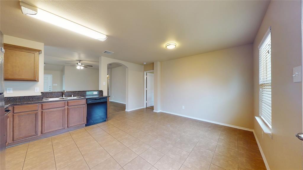 471 Harding Lane Lavon, TX 75166 - Photo 19 of 19 Kitchen featuring arched walkways, ceiling fan, dishwasher, and open floor plan