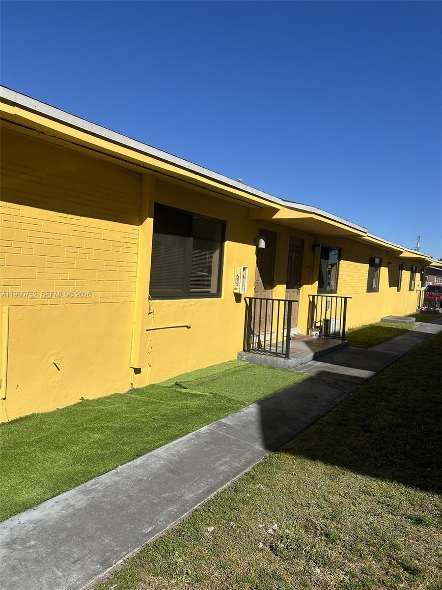 34 West 31st Street, Unit 4 Hialeah, FL 33012 - Photo 2 of 14 a view of back yard of the house