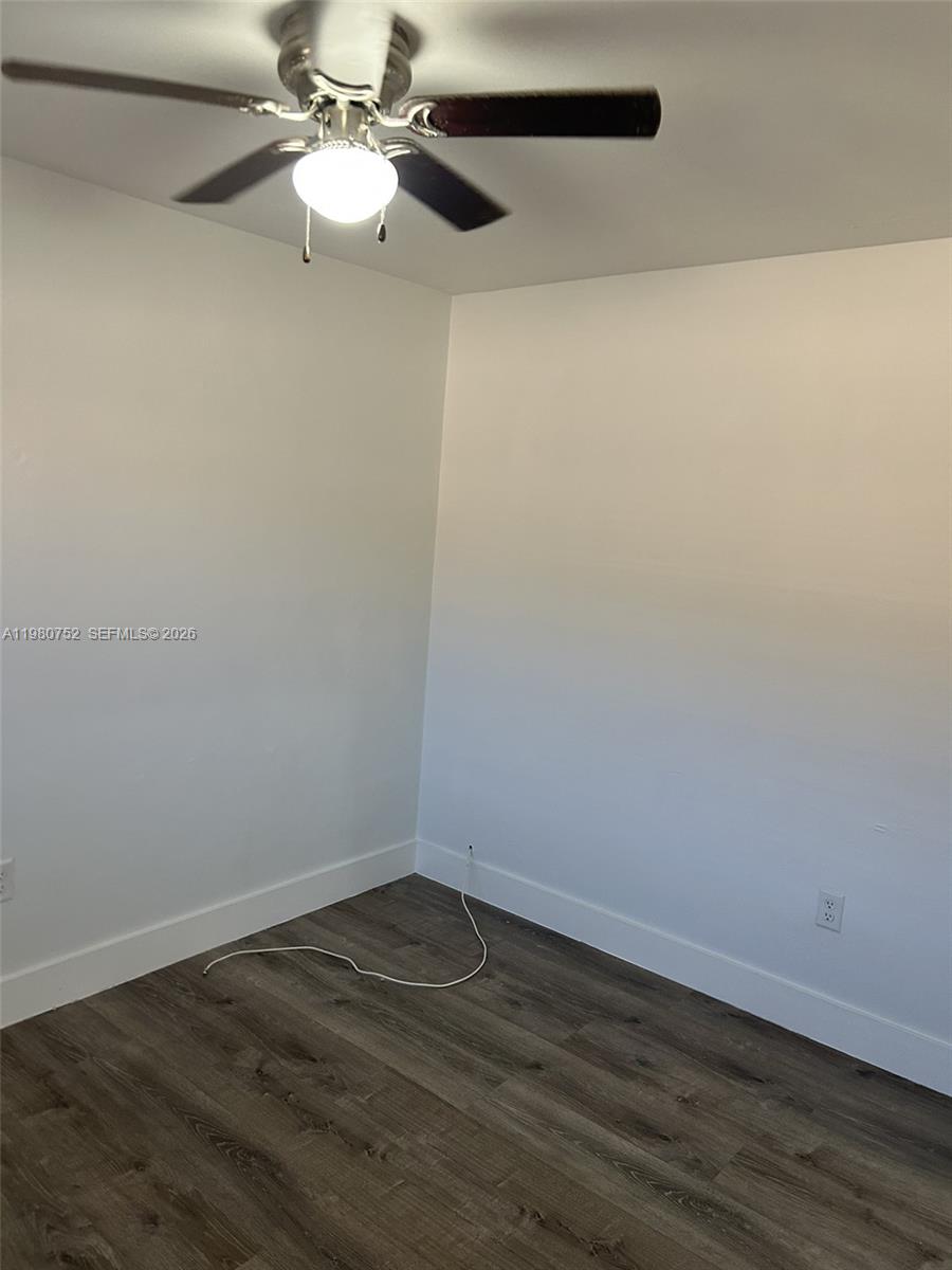 34 West 31st Street, Unit 4 Hialeah, FL 33012 - Photo 5 of 14 a view of an empty room with wooden floor
