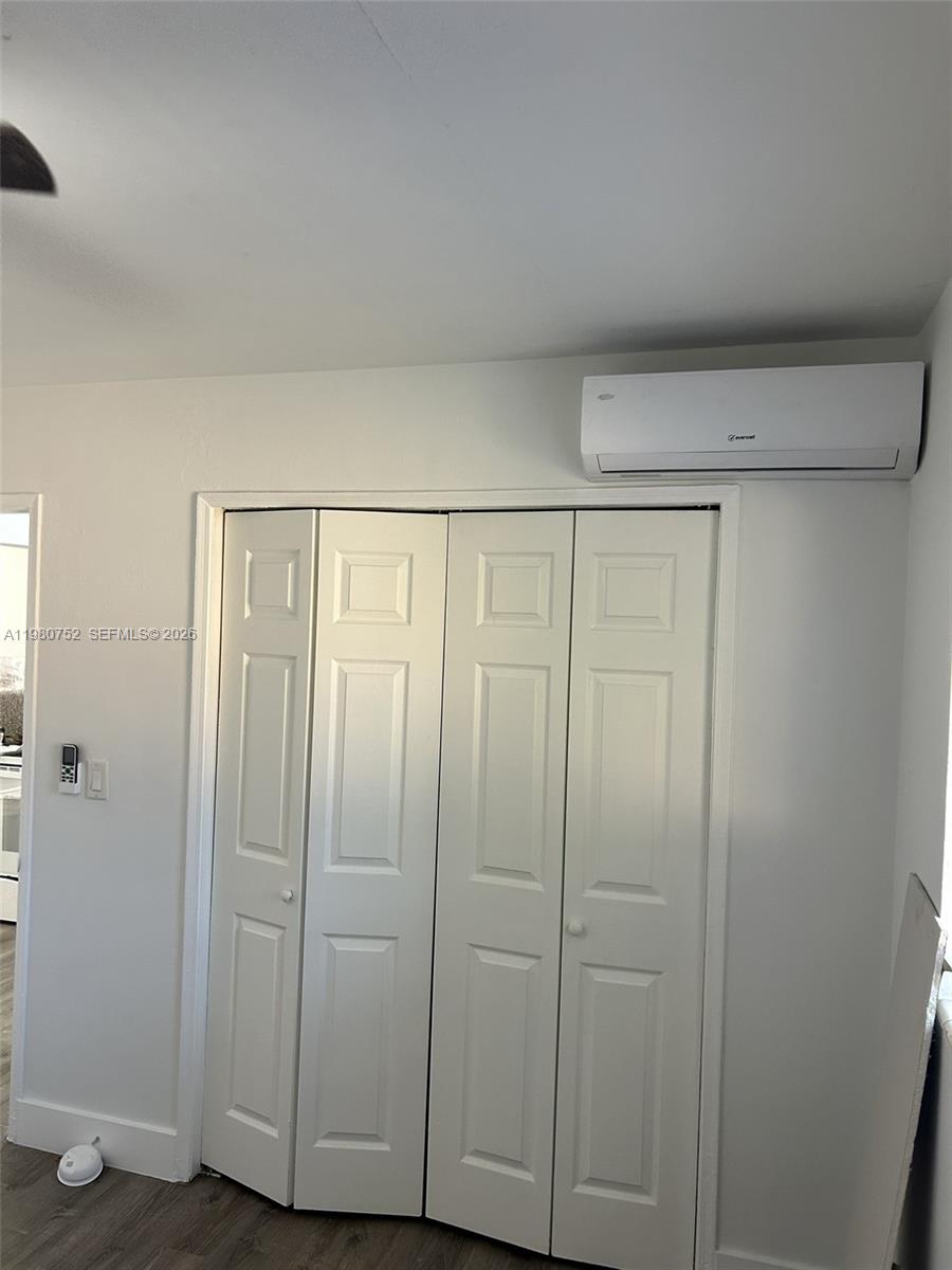 34 West 31st Street, Unit 4 Hialeah, FL 33012 - Photo 6 of 14 a view of a closet area with hardwood floor