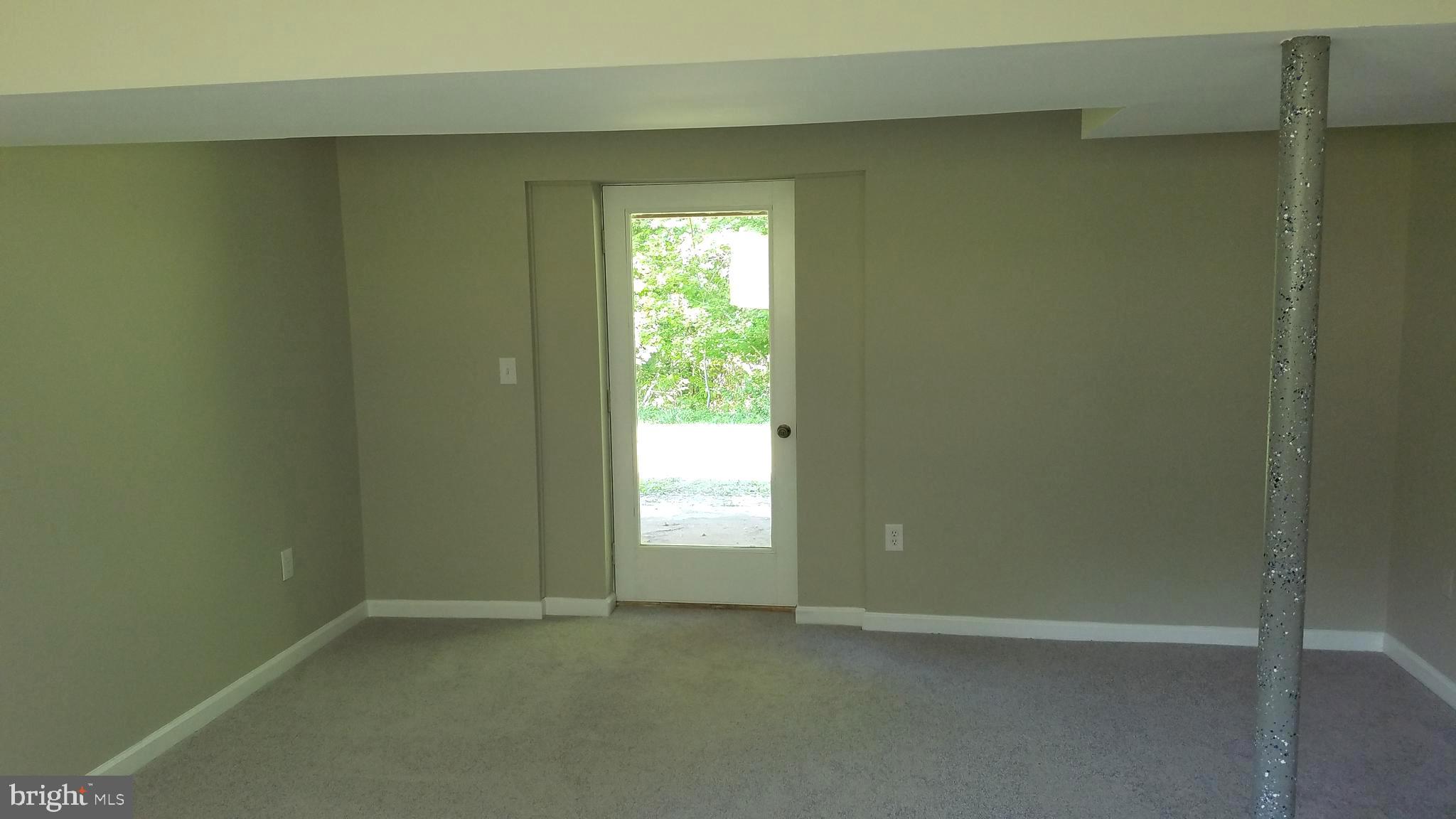 601 Walton Road Huntingtown, MD 20639 - Photo 22 of 36 Lower Level Recreation Room with exit to backyard