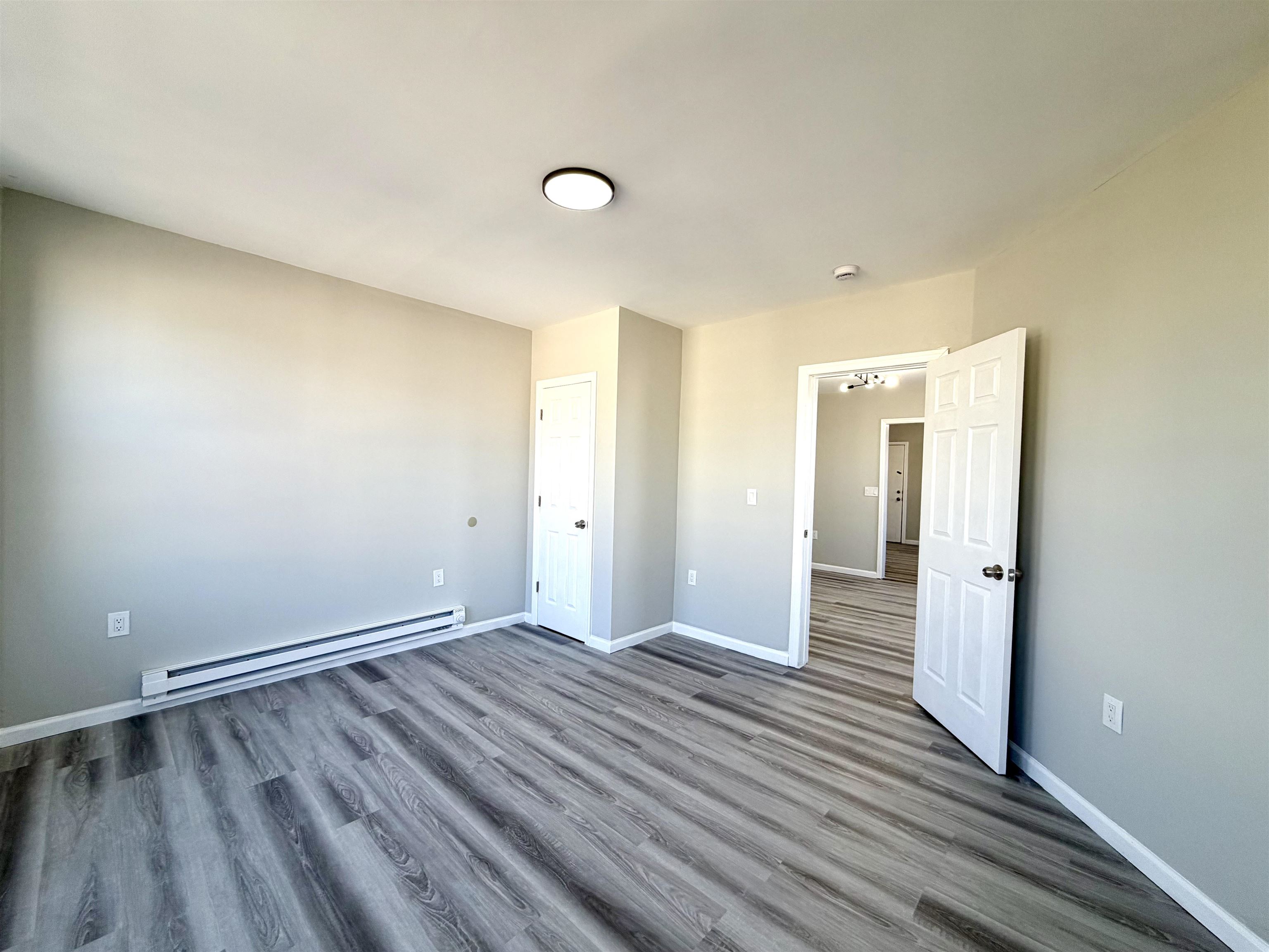 67 Elm Road, Unit 4 Newark, NJ 07105 - Photo 4 of 9 a view of a room with wooden floor