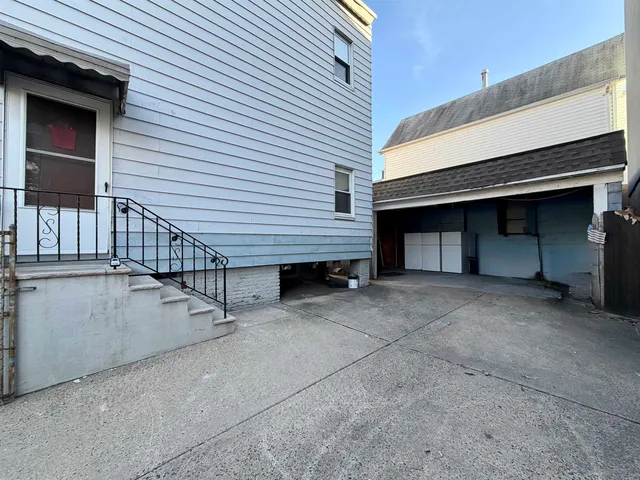 a view of a house with wooden stairs