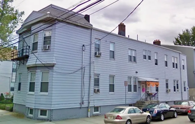 a view of a car park in front of a building