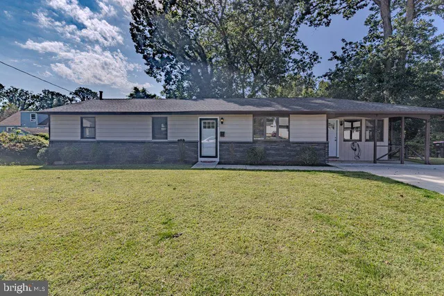 front view of a house with a yard