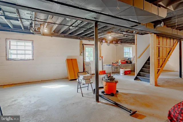 a storage room with furniture and stairs