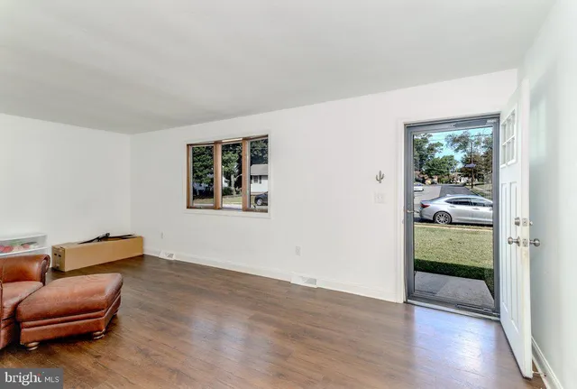 a view of room with furniture and wooden floor