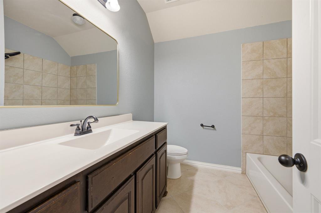 140 Heather Lane Decatur, TX 76234 - Photo 29 of 39 a bathroom with a sink a toilet and shower