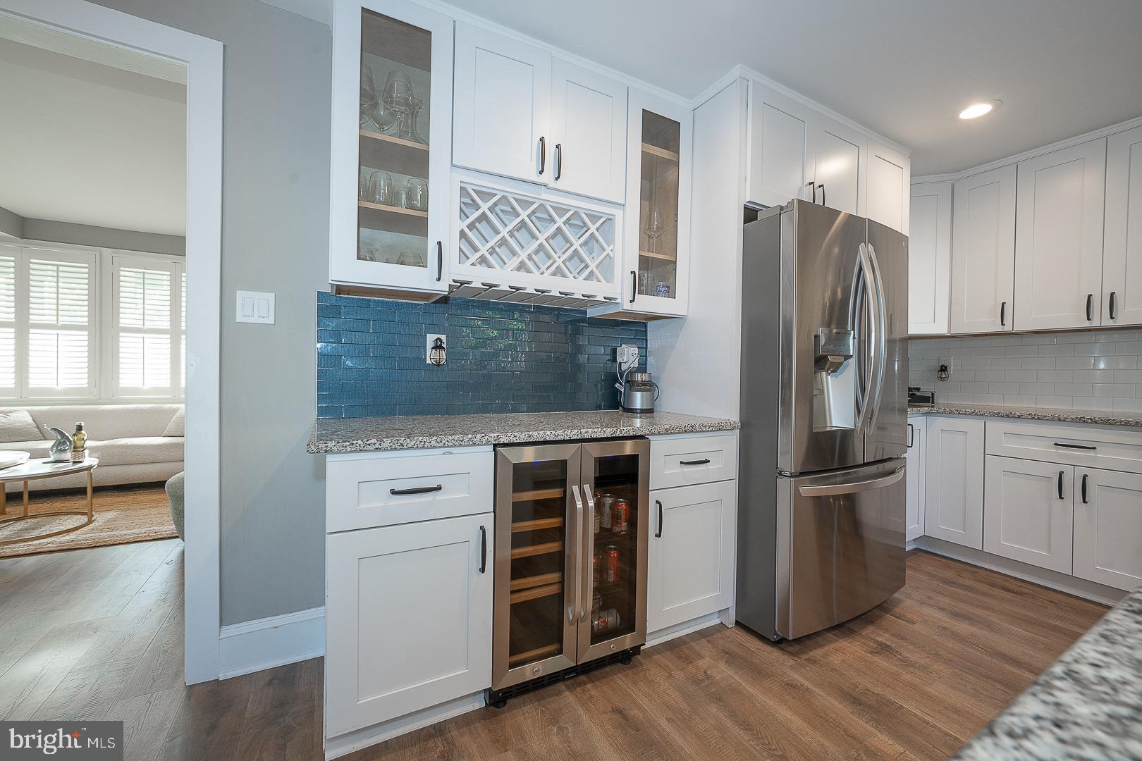 29 Manor Road Paoli, PA 19301 - Photo 13 of 40 a kitchen with a refrigerator and a stove top oven