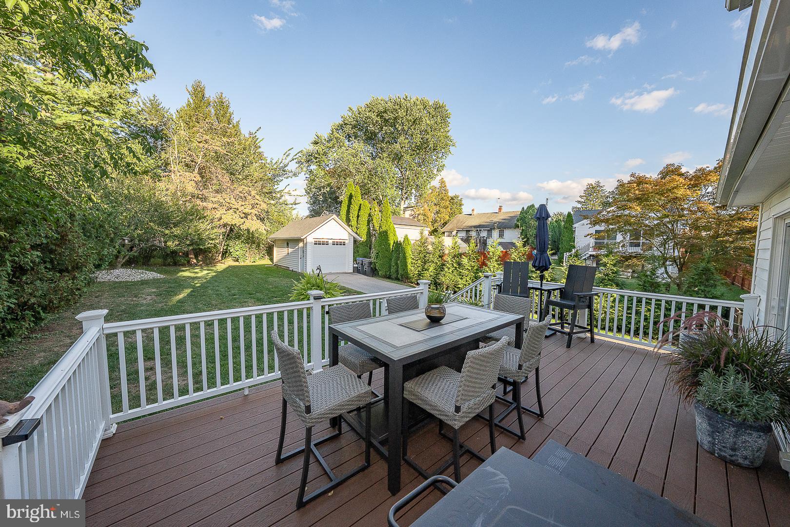 29 Manor Road Paoli, PA 19301 - Photo 38 of 40 a view of a dinning table and chairs on the roof deck