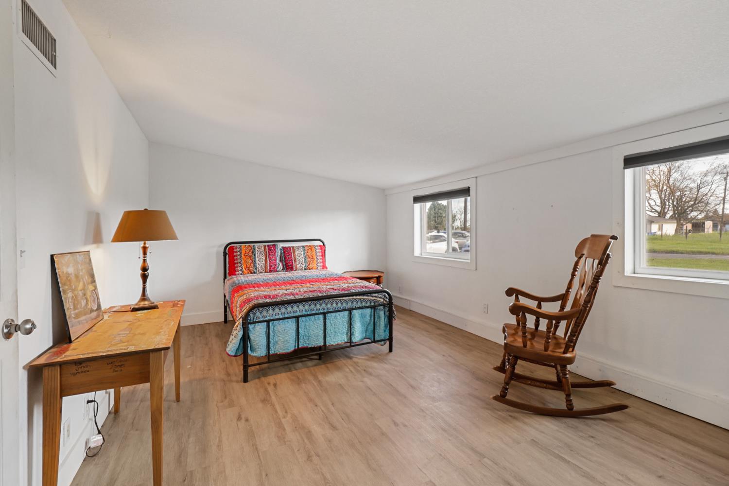 10695 Calvine Road Sacramento, CA 95830 - Photo 11 of 26 a living room with furniture and a wooden floor