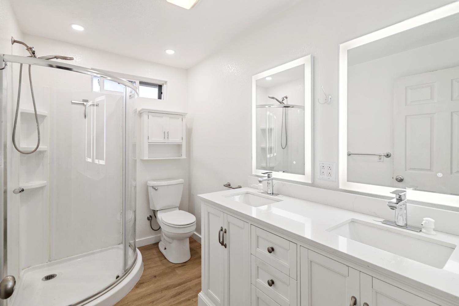10695 Calvine Road Sacramento, CA 95830 - Photo 13 of 26 a bathroom with a double vanity sink toilet mirror and shower