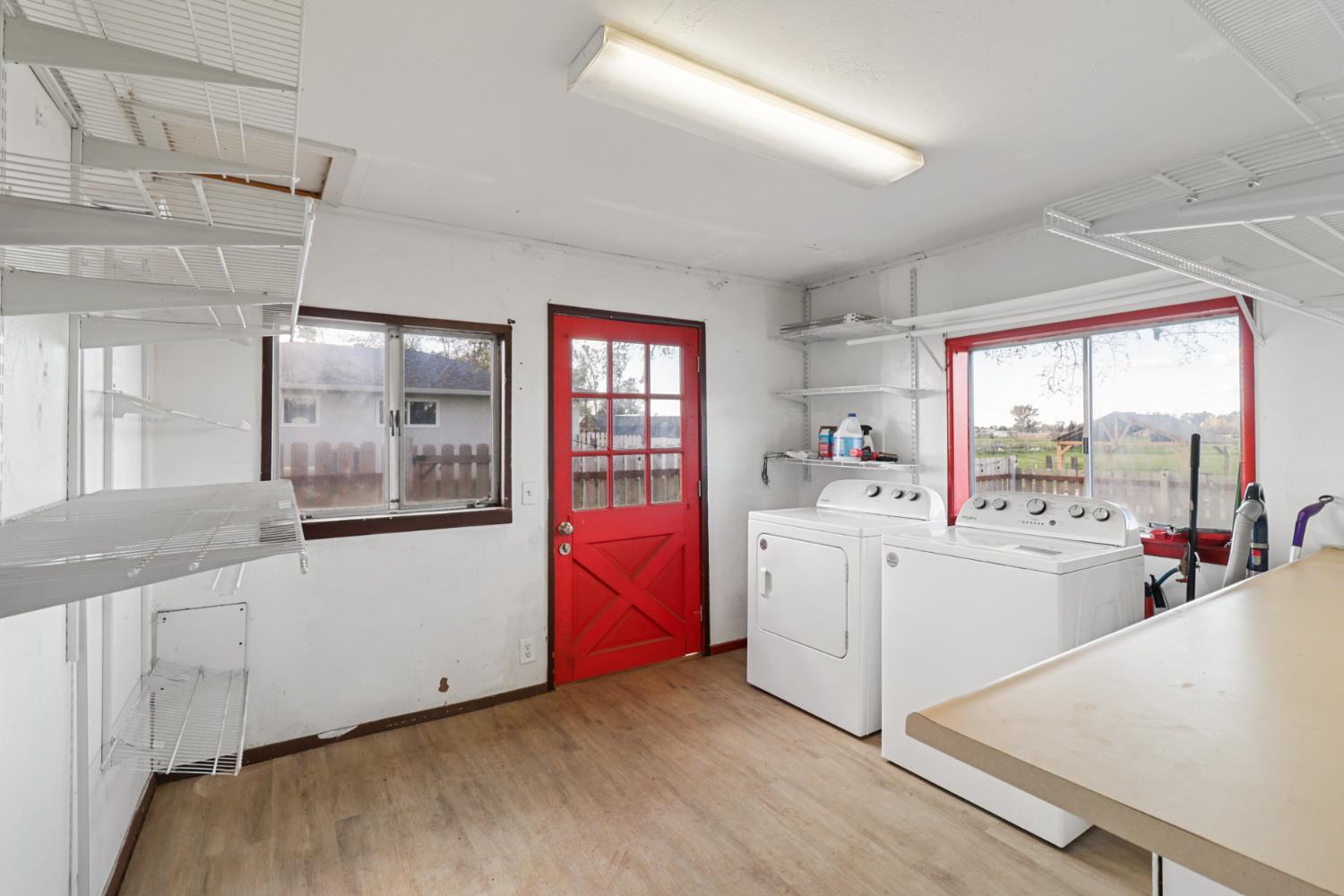 10695 Calvine Road Sacramento, CA 95830 - Photo 15 of 26 a large white kitchen with sink and refrigerator