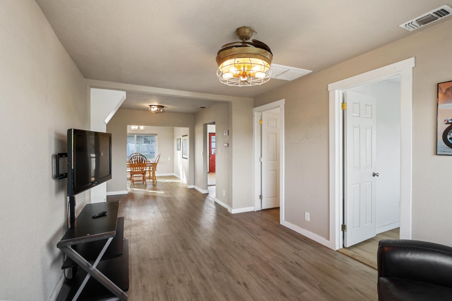 10695 Calvine Road Sacramento, CA 95830 - Photo 2 of 26 a view of a livingroom with furniture and a flat screen tv