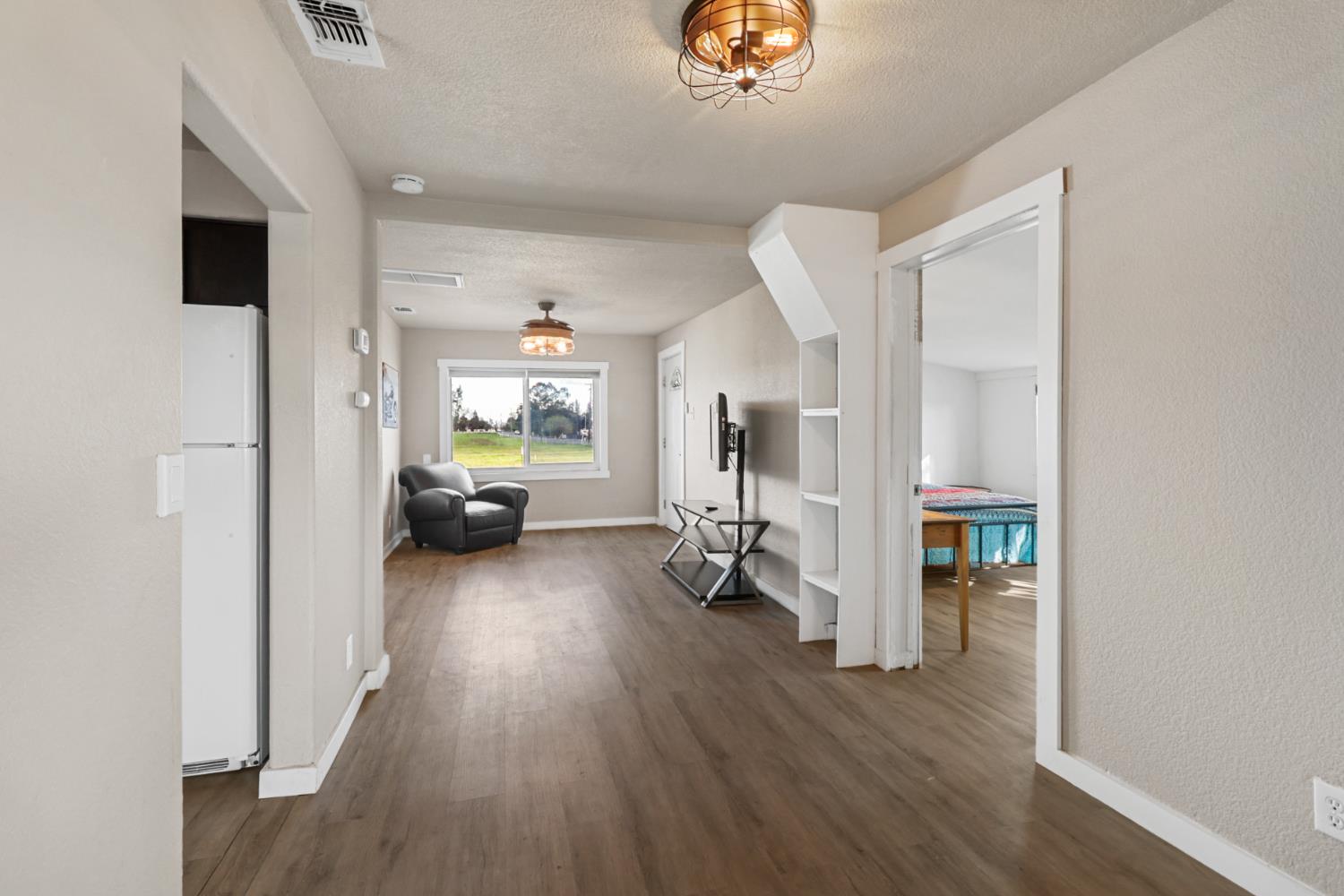 10695 Calvine Road Sacramento, CA 95830 - Photo 6 of 26 a view of living room with furniture and wooden floor