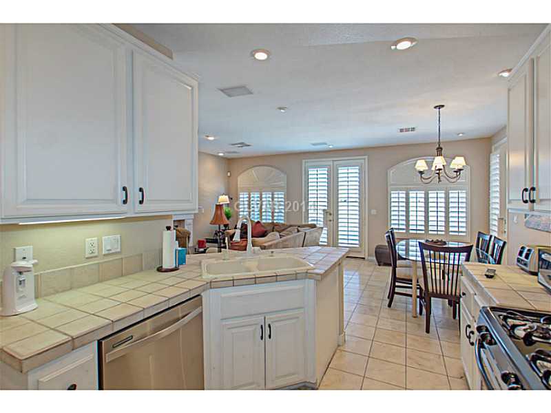 905 Collingtree Street Las Vegas, NV 89145 - Photo 9 of 35 Kitchen. Tuscon Tile Counters & Stainless Steel Appliances all included.