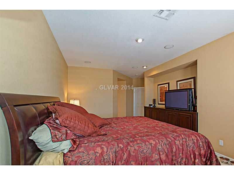 905 Collingtree Street Las Vegas, NV 89145 - Photo 10 of 35 Master Bedroom. Master Bedroom Suite w/ Dual French Doors to Patio/Pool, Travertine, Built in Custom Cabinet w/ Hideaway Flat Screen TV & Components
