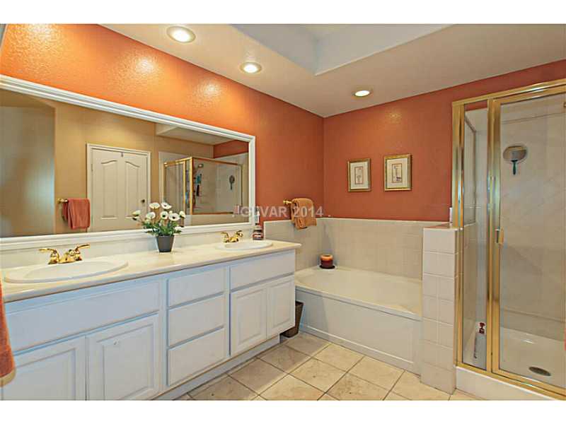 905 Collingtree Street Las Vegas, NV 89145 - Photo 11 of 35 Master Bath/Spa. Enjoy your InSuite Master Bath w/ Dual Vanity, Garden Tub, Walk in Shower & Flat Screen TV. Walk in Closet w/ Custom Builtins