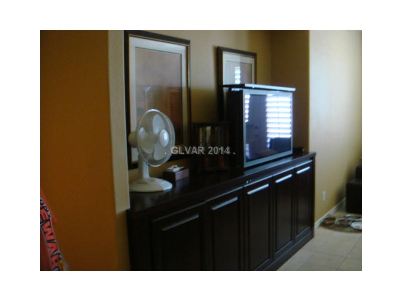 905 Collingtree Street Las Vegas, NV 89145 - Photo 18 of 35 Master Bedroom. Built in Cabinet with hideaway TV & Components