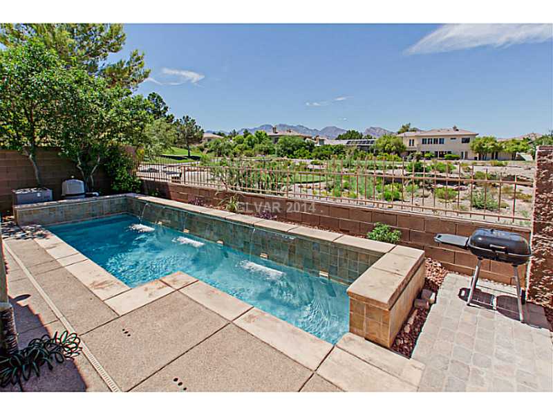 905 Collingtree Street Las Vegas, NV 89145 - Photo 2 of 35 Swimming Pool/Hot Tub/Sauna. Your own Pool w/ Waterfall and Amazing Golf and Mountain Views