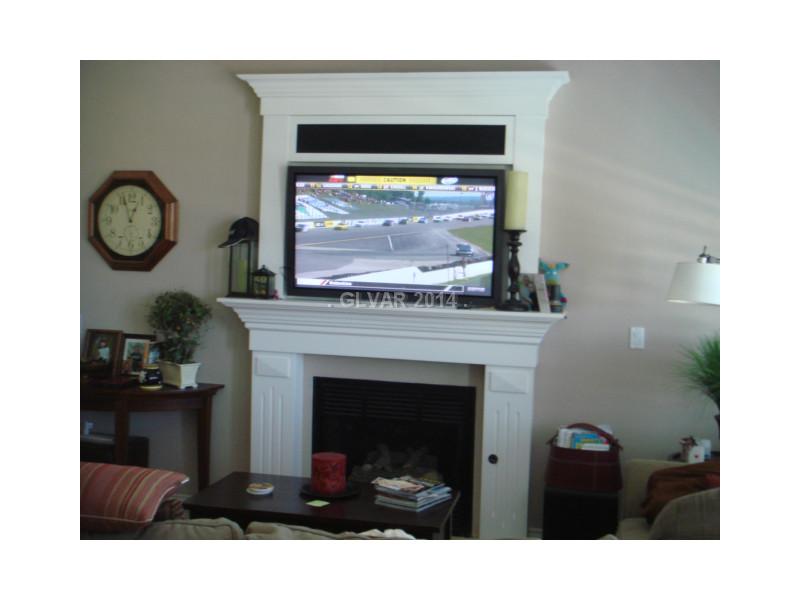905 Collingtree Street Las Vegas, NV 89145 - Photo 22 of 35 Den. Custom Fireplace Mantle and Surround w/ Built in Flat Screen TV & Components