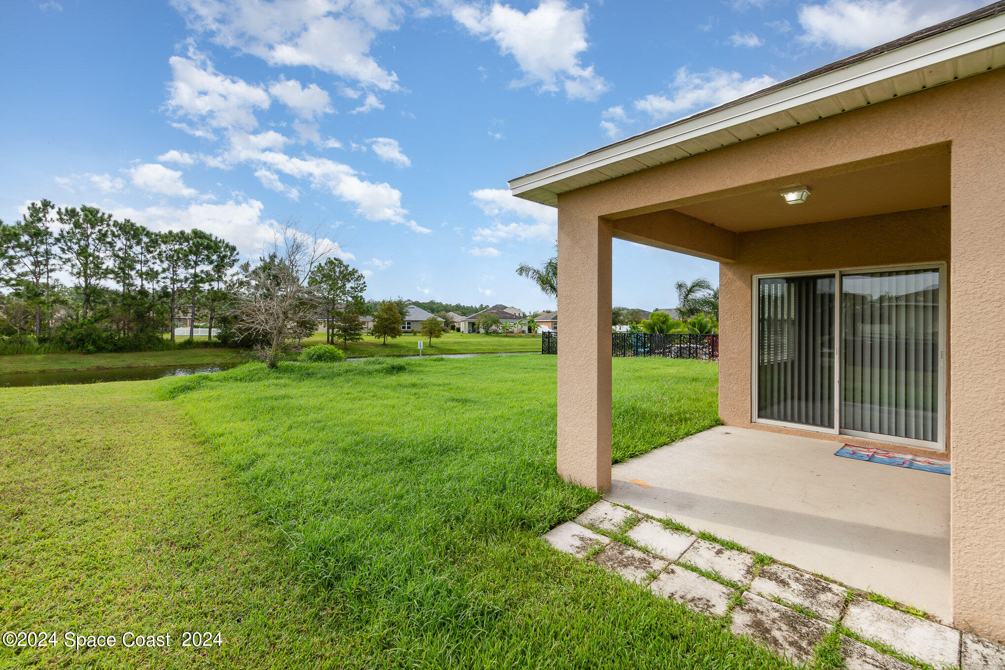 5305 Bear Corn Run Port Orange, FL 32128 - Photo 26 of 33 a view of a backyard with a garden and plants