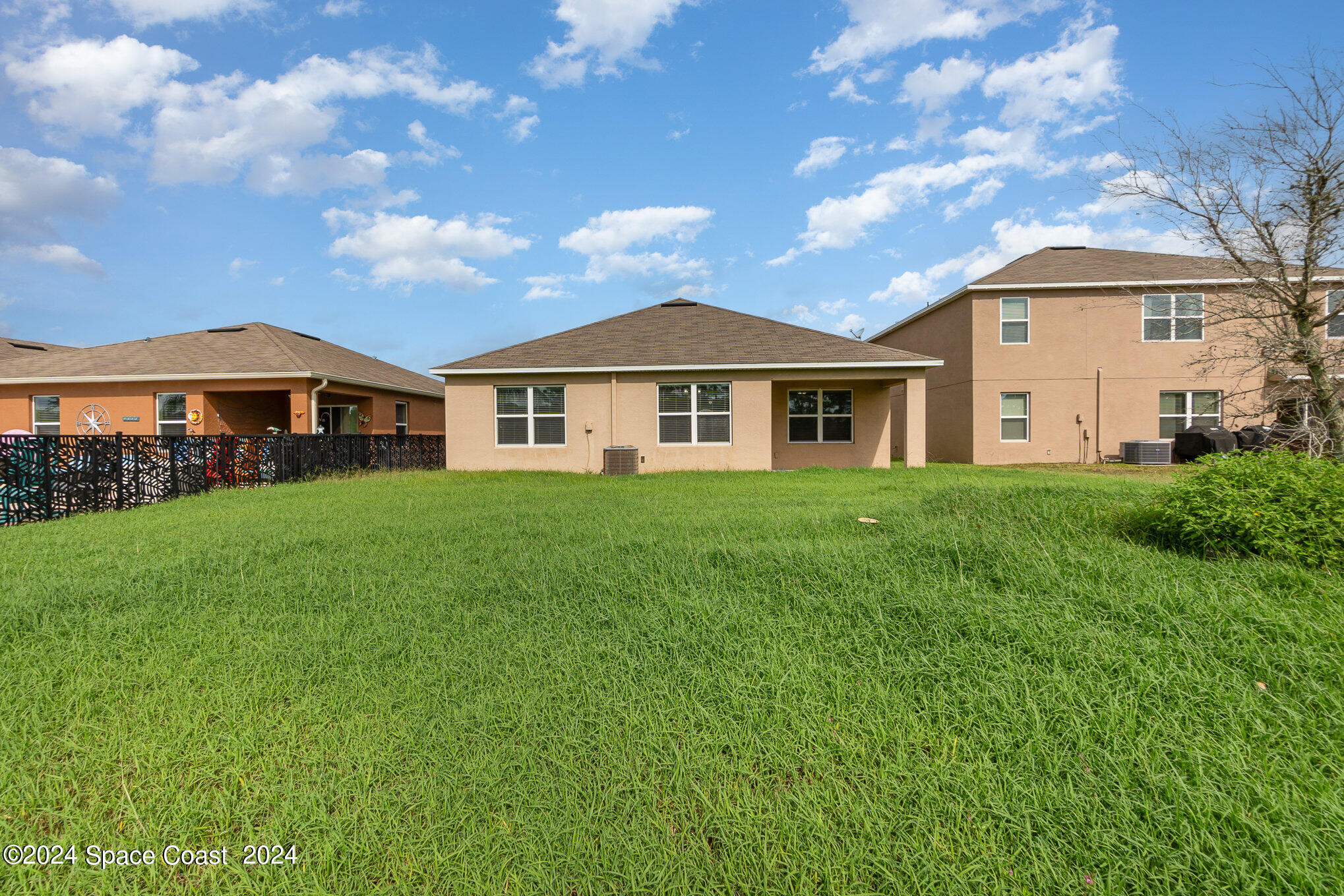 5305 Bear Corn Run Port Orange, FL 32128 - Photo 27 of 33 a front view of a house with garden