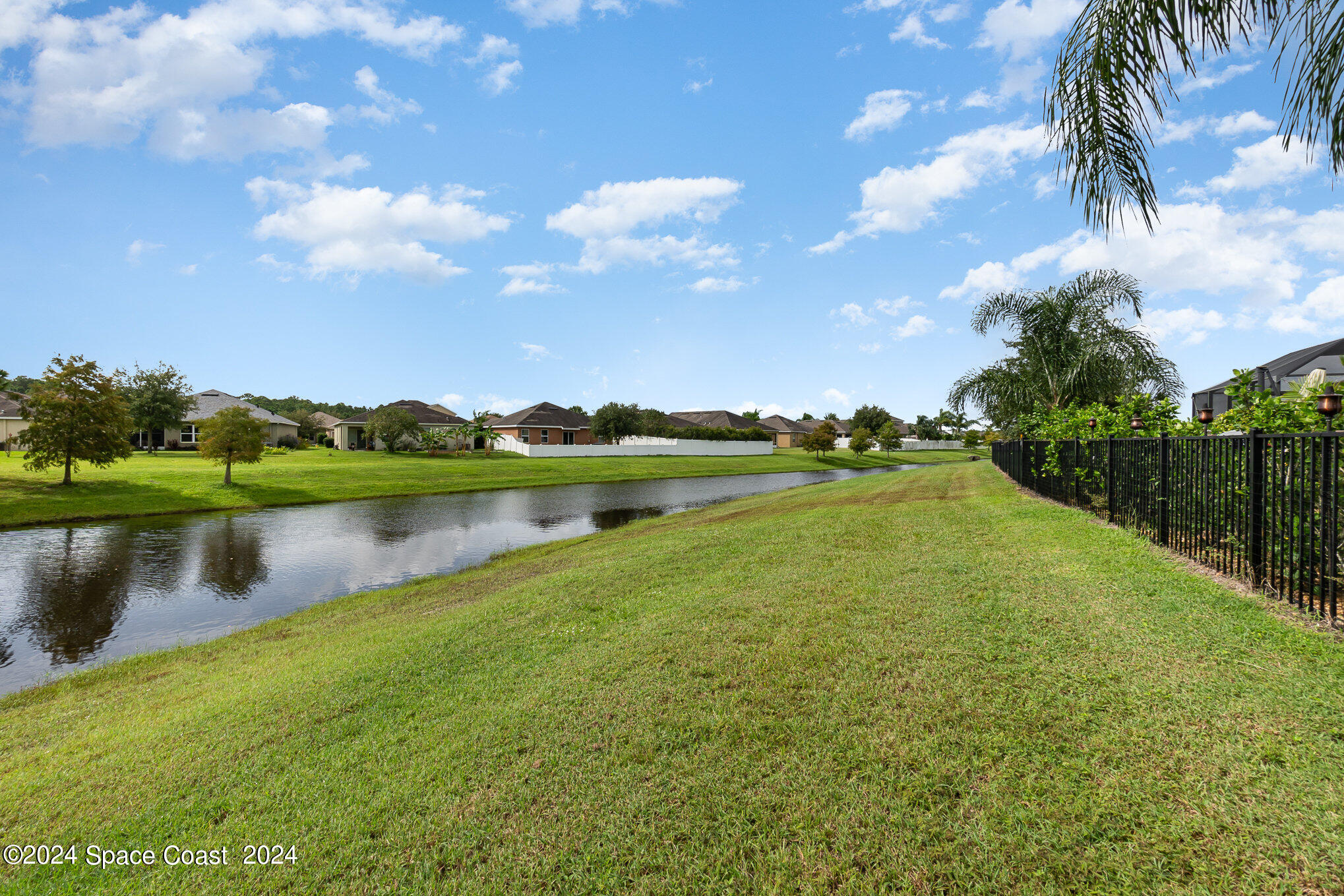 5305 Bear Corn Run Port Orange, FL 32128 - Photo 30 of 33 a view of a lake with houses in the background