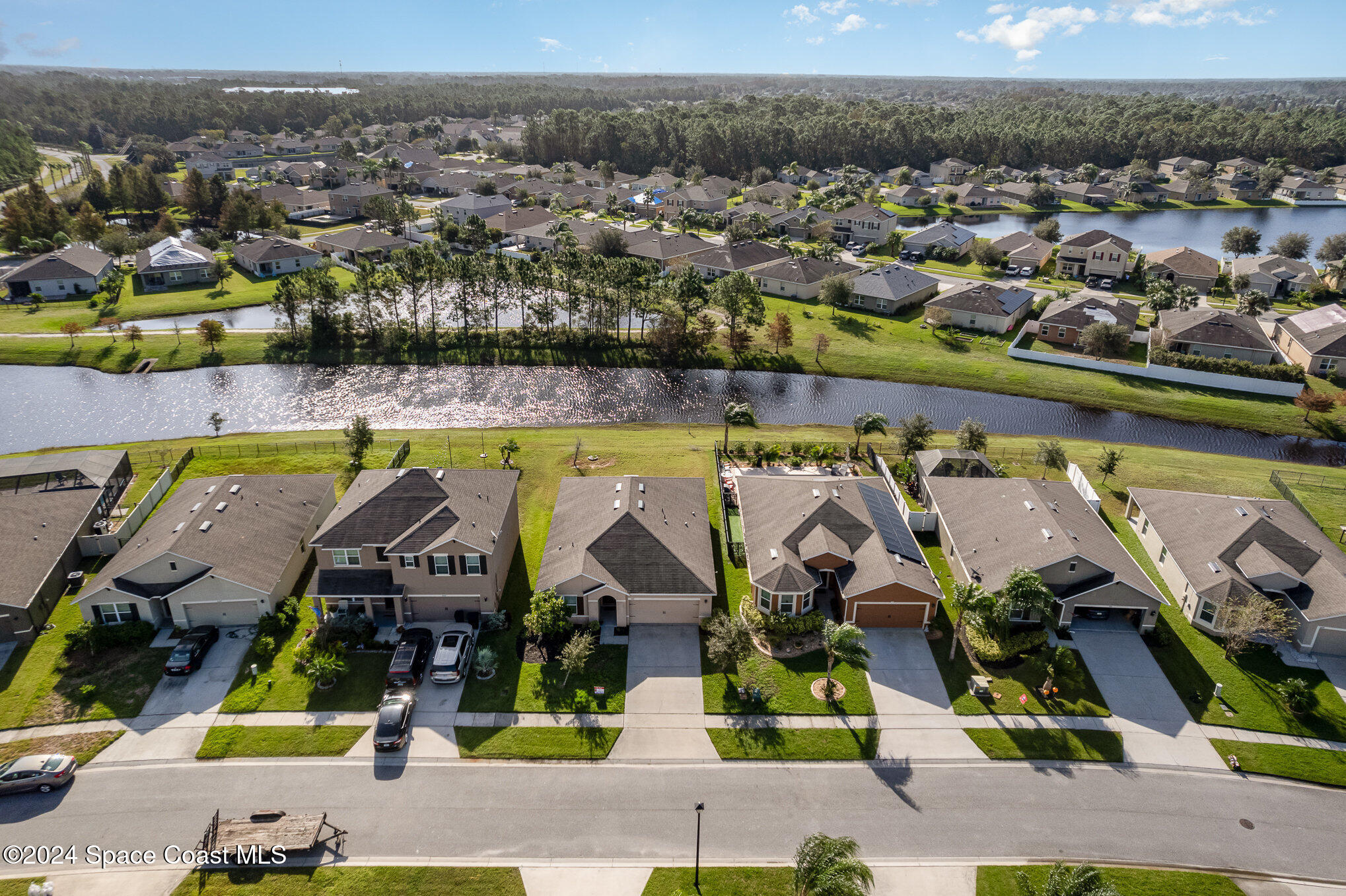 5305 Bear Corn Run Port Orange, FL 32128 - Photo 4 of 33 an aerial view of a house with a swimming pool yard and outdoor seating