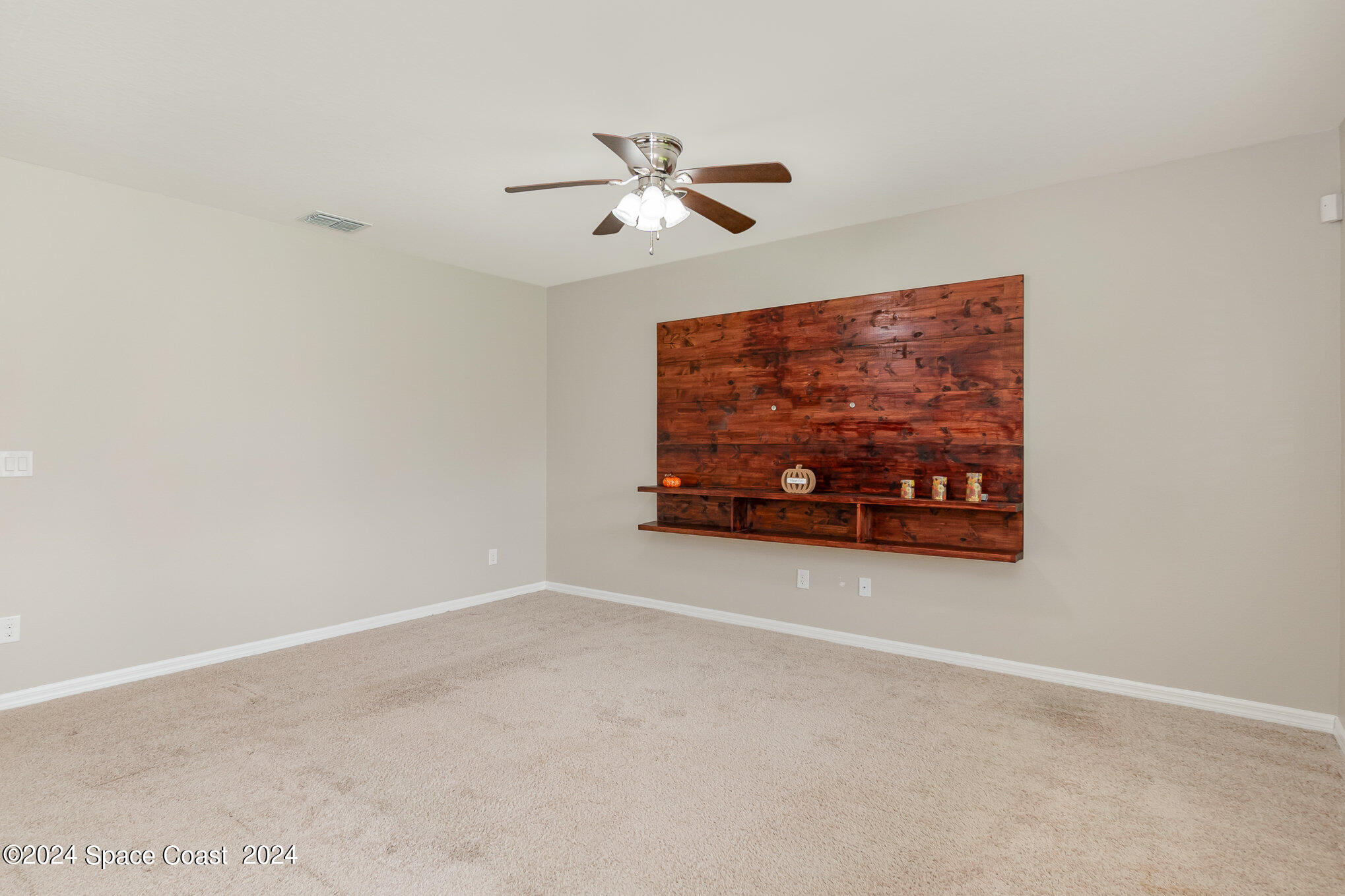 5305 Bear Corn Run Port Orange, FL 32128 - Photo 7 of 33 a living room with furniture and a ceiling fan