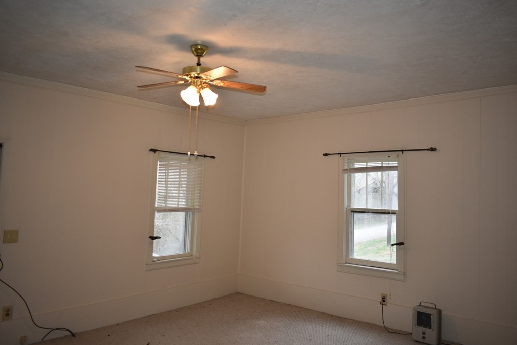 293 Enigma Road Chestnut Mound, TN 38552 - Photo 3 of 13 an empty room with windows and fan