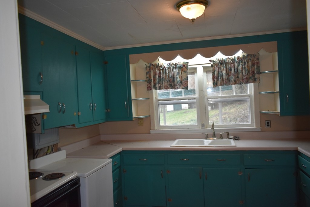 293 Enigma Road Chestnut Mound, TN 38552 - Photo 4 of 13 a kitchen with a sink and large window