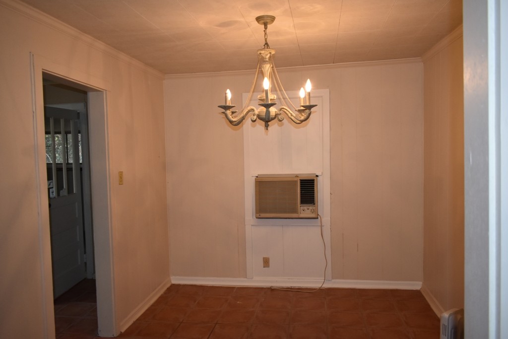 293 Enigma Road Chestnut Mound, TN 38552 - Photo 5 of 13 a view of a room with a hanging light and kitchen