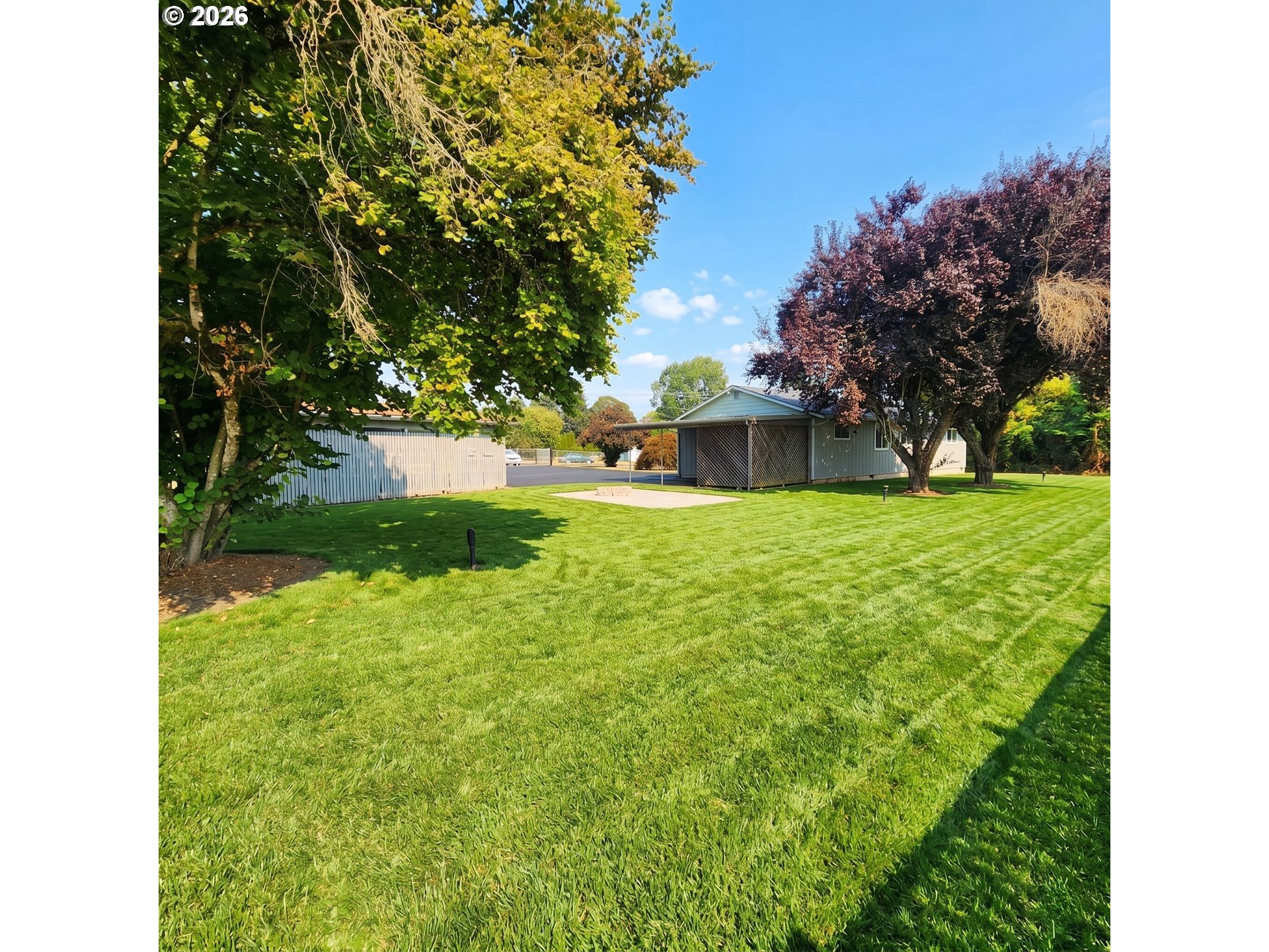 54047 West Lane Road Scappoose, OR 97056 - Photo 31 of 44 a view of a backyard with a garden