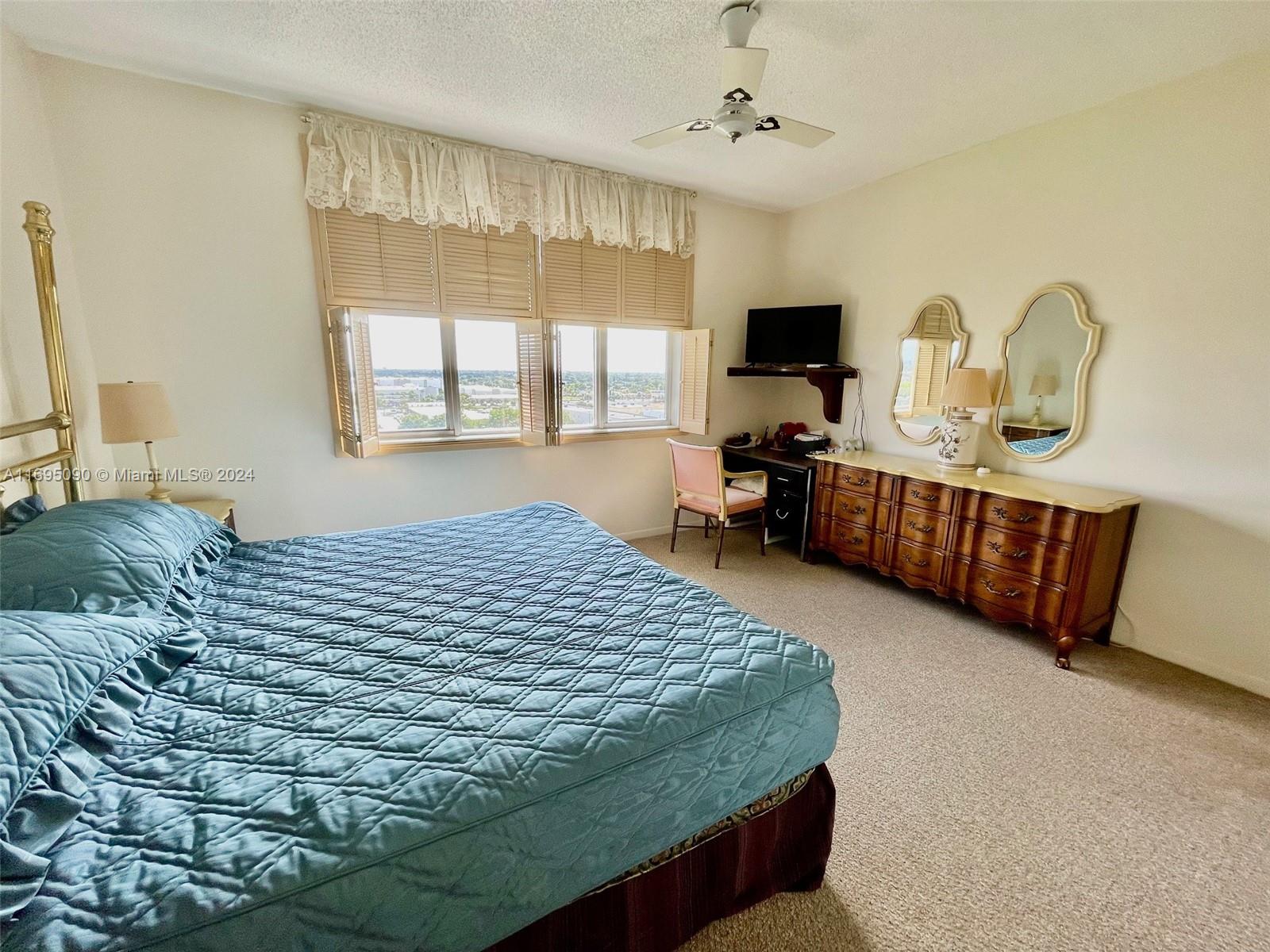 Hillcrest Hollywood, FL 33021 - Photo 10 of 29 a bedroom with a bed and flat screen tv