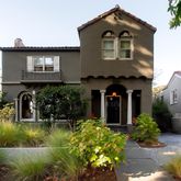 a front view of a house with a yard