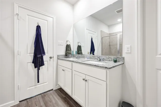 a bathroom with a sink and mirror