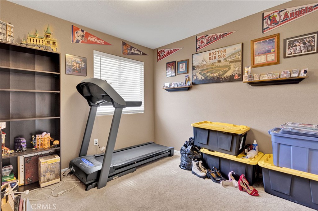 20403 Ochoa Road Apple Valley, CA 92307 - Photo 36 of 48 a room with gym equipment and a window