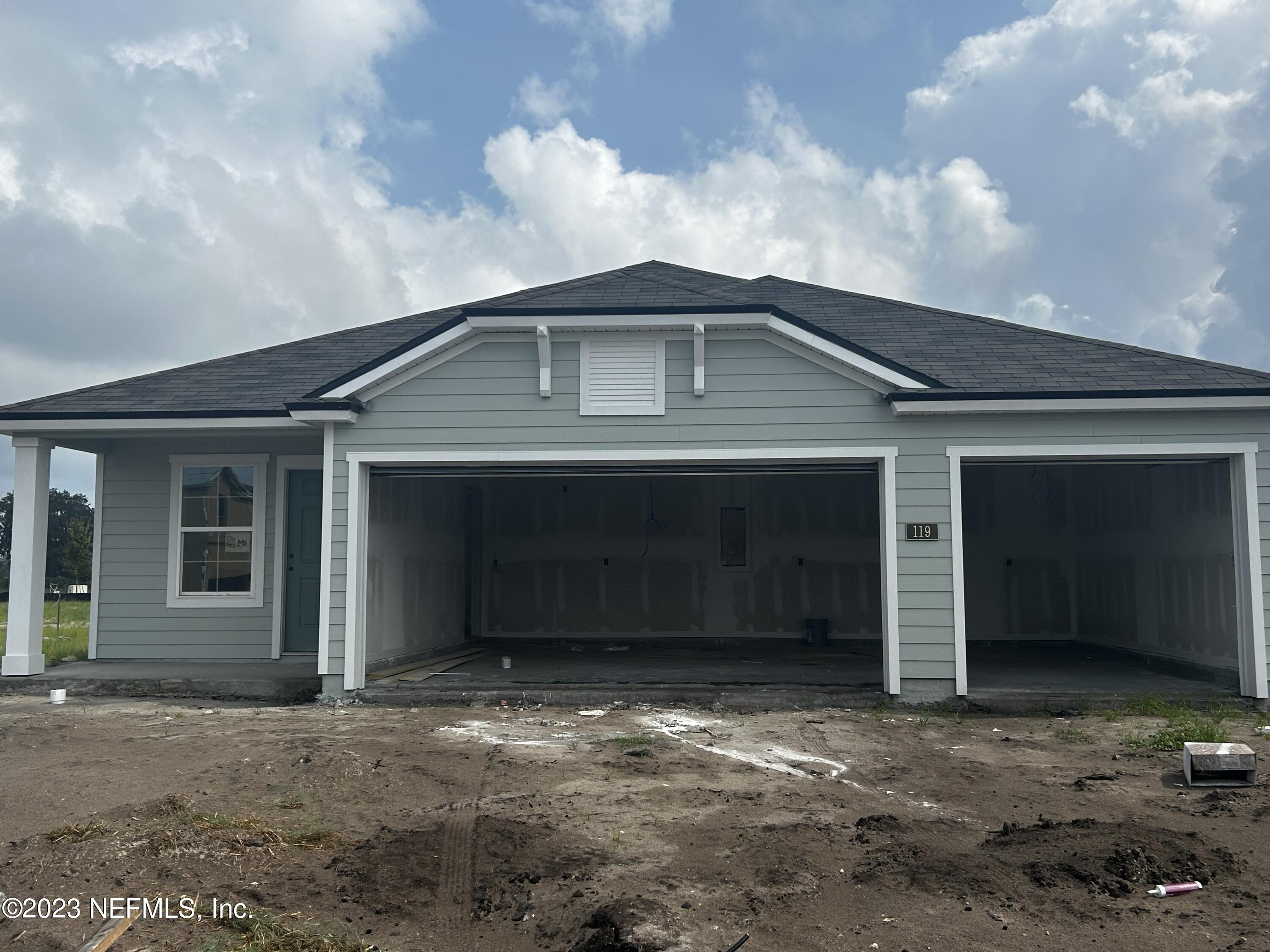 119 Mula Ct Street St. Augustine, FL 32084 - Photo 1 of 37 a front view of a house with a yard and garage