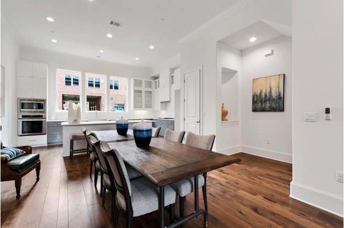 1312 Tinnin Ford Road Austin, TX 78741 - Photo 4 of 12 a view of a dining room with furniture and wooden floor
