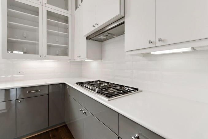 1312 Tinnin Ford Road Austin, TX 78741 - Photo 9 of 12 a kitchen with cabinets and appliances