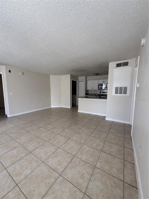 2201 Key W Court, Unit 314 Kissimmee, FL 34741 - Photo 11 of 58 a view of a kitchen with a sink and an empty room