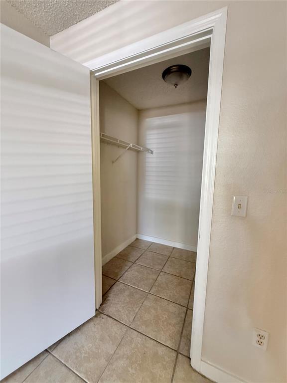 2201 Key W Court, Unit 314 Kissimmee, FL 34741 - Photo 27 of 58 a bathroom with a glass door shower